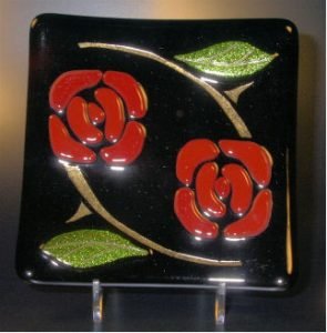 NOUVEAU ROSE D'OR 6" sushi style black dish or plate with lightly fused roses and leaves. The stems were sandblasted and inlaid with 23kt gold.