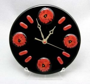 POPPY CLOCK 8" clock with pattern bar accents. Wall mounting hardware included.